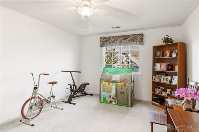 recreation room featuring carpet and ceiling fan