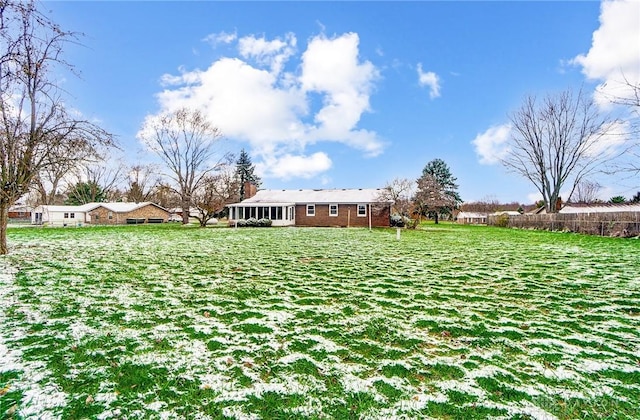 view of yard featuring a sunroom