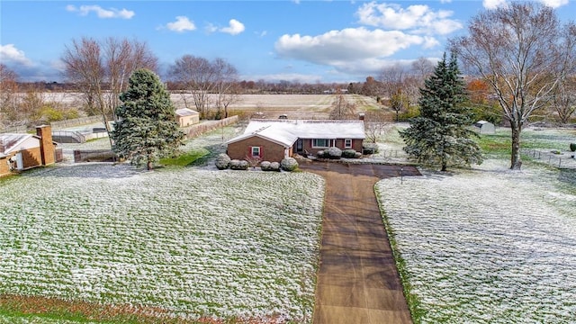 view of yard with a rural view