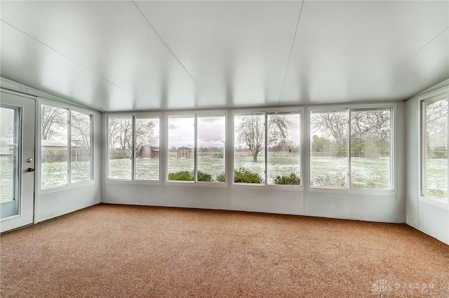 unfurnished sunroom with a water view