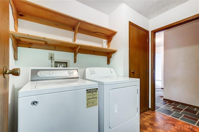 clothes washing area with washer and dryer