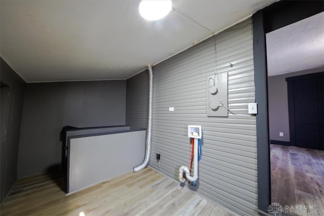 washroom with washer hookup and hardwood / wood-style flooring