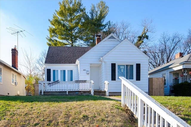 bungalow-style home featuring a front yard