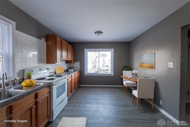 kitchen with decorative backsplash, sink, white electric stove, and dark wood-type flooring