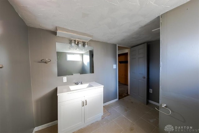 bathroom with tile patterned flooring and vanity