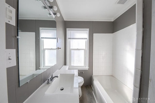 bathroom with wood-type flooring, vanity, toilet, and ornamental molding