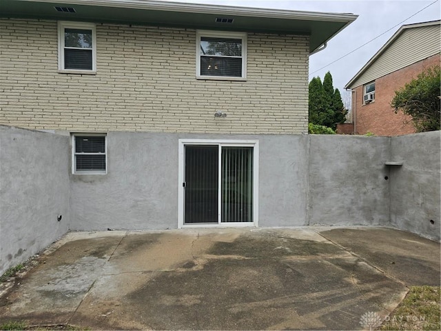 rear view of property with a patio