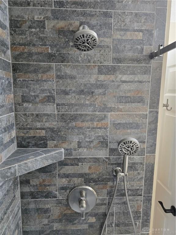 bathroom featuring a tile shower