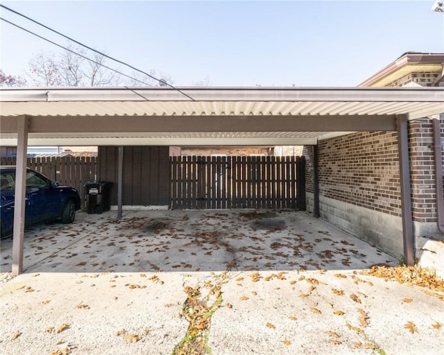 view of side of home with a carport