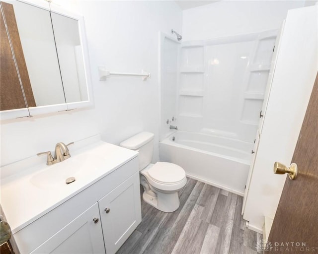 full bathroom with toilet, vanity, tub / shower combination, and hardwood / wood-style flooring