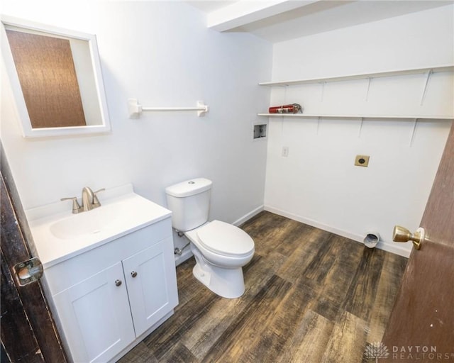 bathroom featuring hardwood / wood-style floors, vanity, and toilet