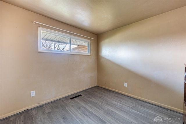 spare room with light hardwood / wood-style flooring