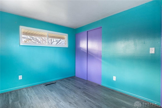 empty room featuring hardwood / wood-style flooring