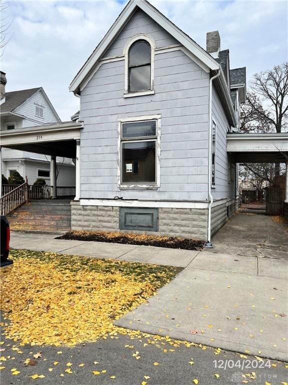 view of home's exterior with a carport