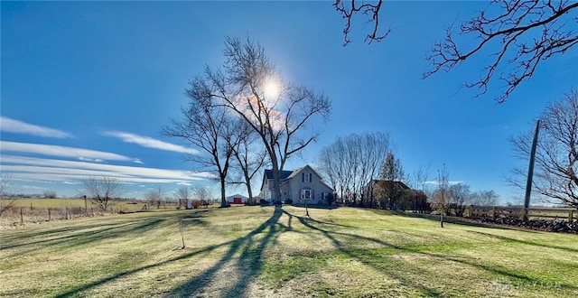 view of yard with a rural view