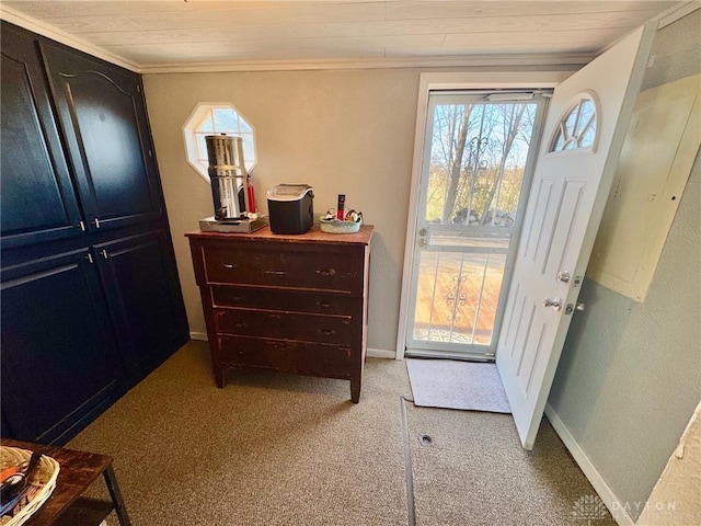 doorway to outside with ornamental molding and light carpet