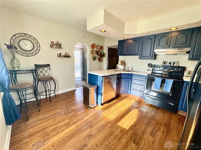 kitchen featuring blue cabinets, sink, stainless steel dishwasher, black / electric stove, and light hardwood / wood-style floors