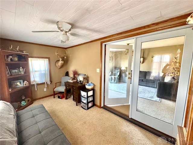 interior space featuring ceiling fan, french doors, carpet, and ornamental molding