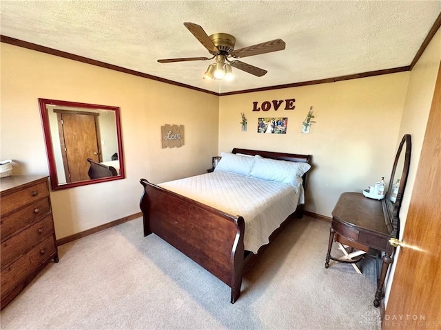 bedroom with ceiling fan, crown molding, a textured ceiling, and light carpet