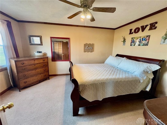 bedroom with carpet flooring, ceiling fan, and ornamental molding