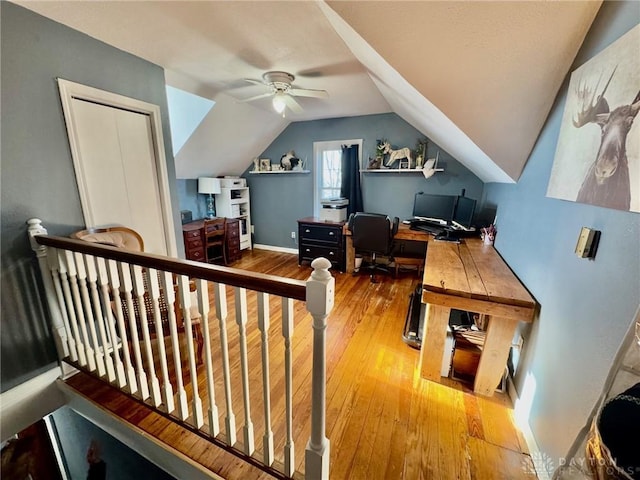 office area with hardwood / wood-style floors, ceiling fan, and vaulted ceiling