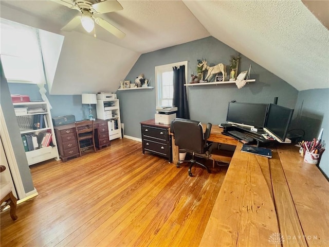 office with ceiling fan, wood-type flooring, and vaulted ceiling