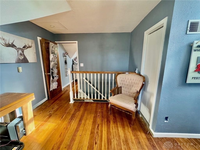 living area featuring hardwood / wood-style flooring