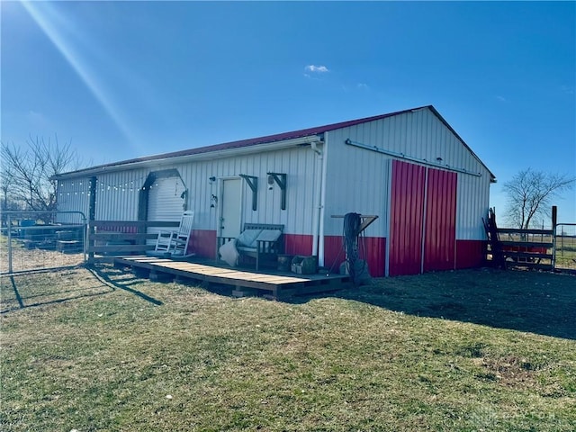 view of outbuilding with a yard