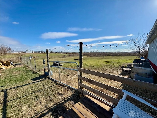 view of yard with a rural view