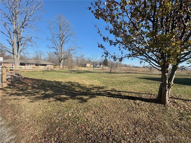 view of yard with a rural view