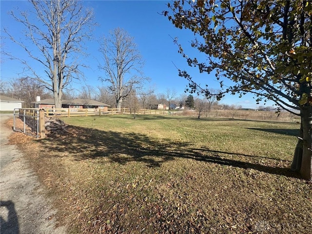 view of yard with a rural view