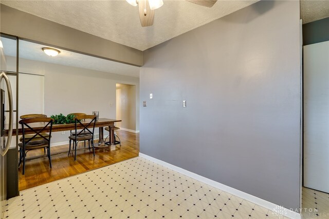 hall featuring a textured ceiling