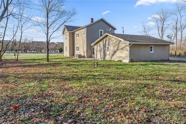 view of side of property with a yard