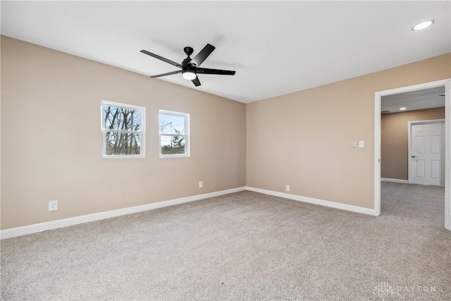 carpeted empty room with ceiling fan