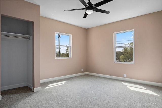 unfurnished bedroom with a ceiling fan, baseboards, a closet, and carpet