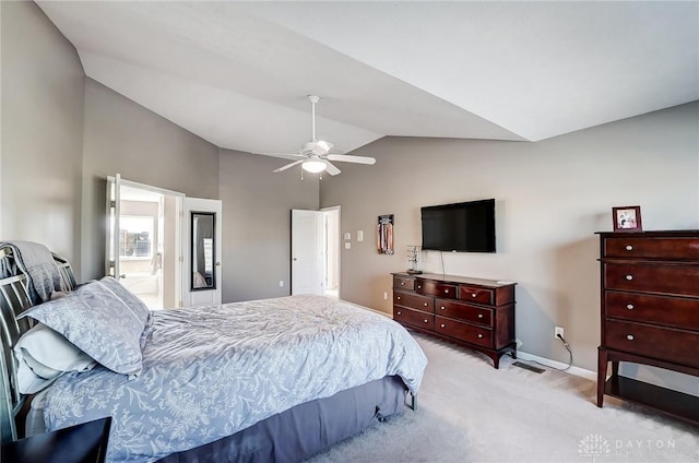 carpeted bedroom featuring ceiling fan, connected bathroom, and vaulted ceiling