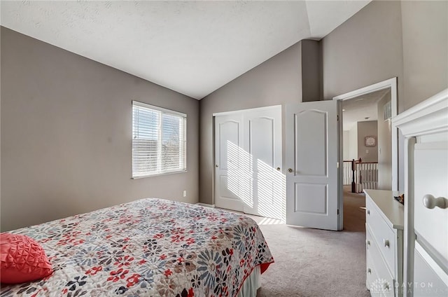 bedroom with light carpet and high vaulted ceiling