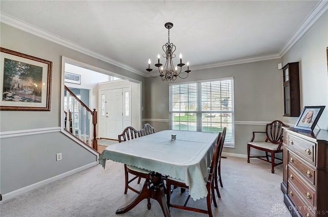 carpeted dining area featuring a notable chandelier and ornamental molding