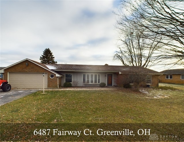 single story home with a front lawn and a garage