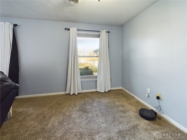 unfurnished room featuring carpet floors