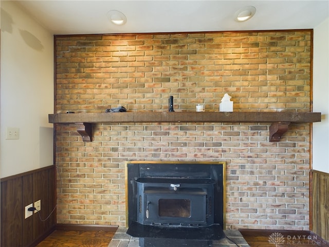 room details with a wood stove and wooden walls