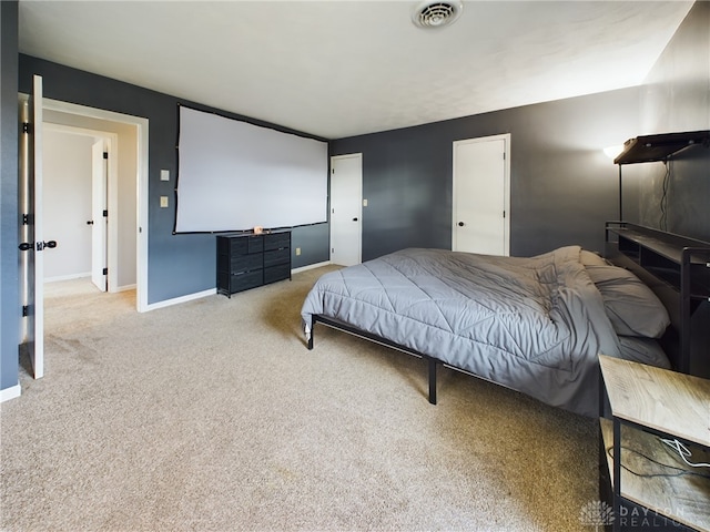 bedroom featuring light carpet