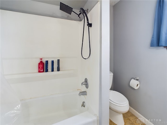 bathroom featuring tile patterned flooring, shower / bathtub combination, and toilet