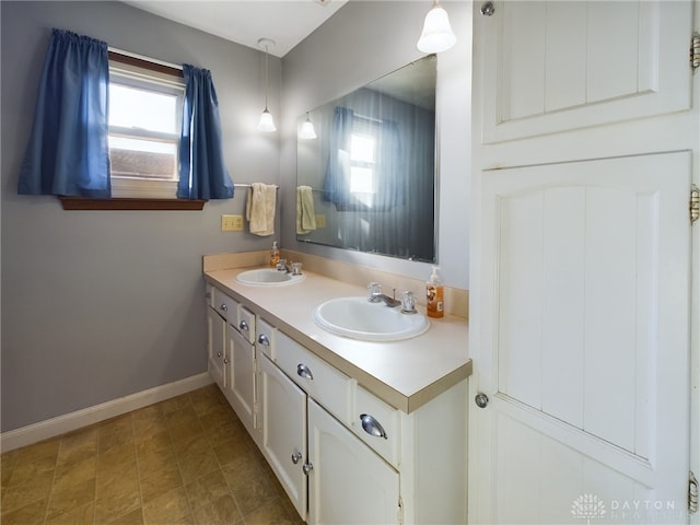 bathroom featuring vanity and a healthy amount of sunlight