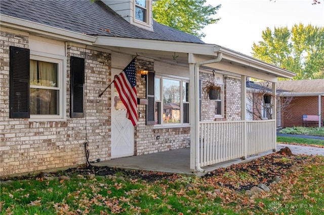 doorway to property featuring covered porch