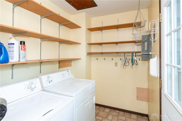 laundry area with independent washer and dryer