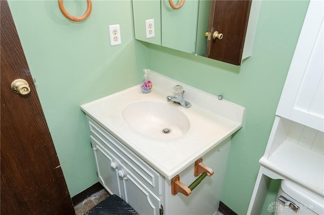 bathroom with tile patterned floors, vanity, and toilet