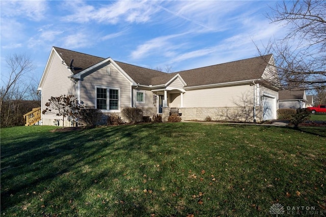 view of front facade with a front lawn and a garage