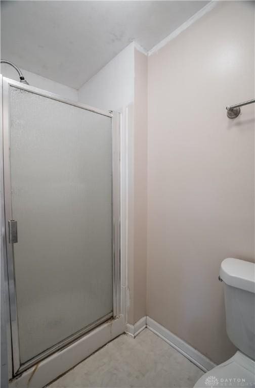 bathroom with toilet and walk in shower