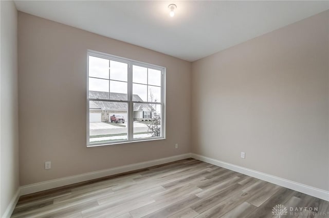 spare room featuring light hardwood / wood-style floors